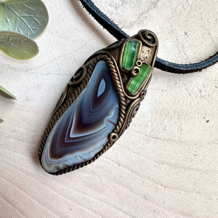 Witchy crystal necklace with Botswana Agate and Green Tourmaline talisman pendant for mystical energy work.