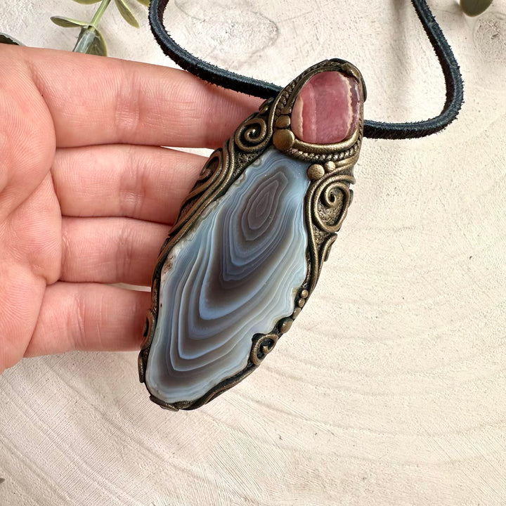 Mineral specimen inspired crystal necklace with raw Botswana agate and rhodochrosite pendant