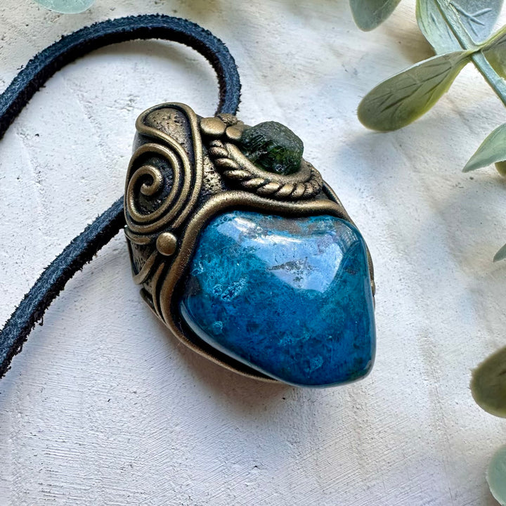 Close up of shattuckite and moldavite pendant
