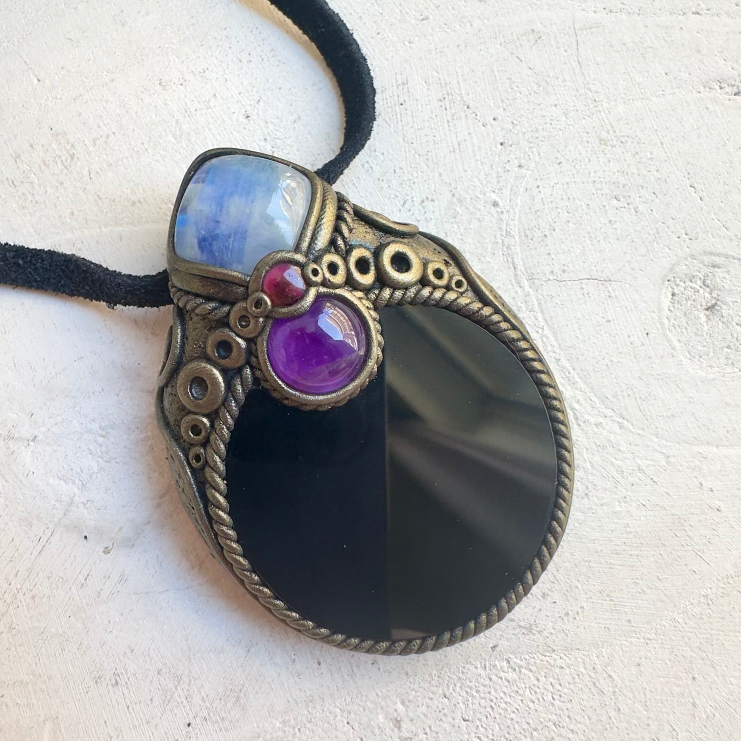 Metaphysical jewelry featuring Amethyst, Moonstone and Obsidian