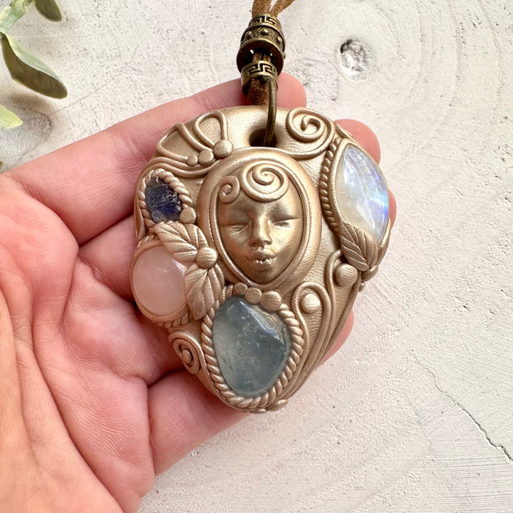 Goddess clay necklace with celestite rainbow moonstone rose quartz and tanzanite