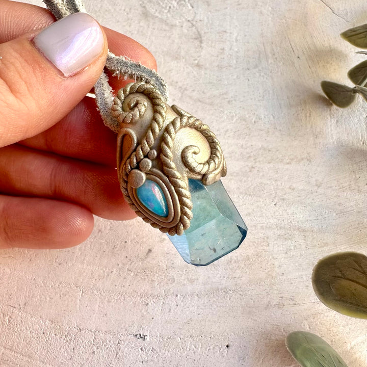 Artisan necklace showcasing shimmering Aqua Aura Quartz with colorful Blue Ethiopian Opal.