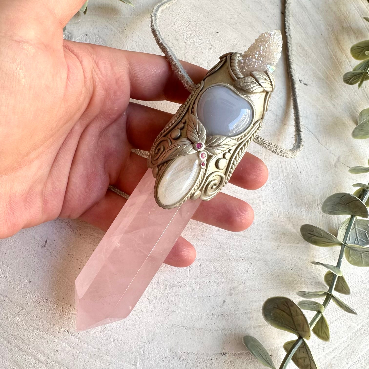 A one of a kind spiritual energy tool combining soft pink, luminous, blue and vibrant red gemstones, created for meditation, intention setting, energy work, self-love and spiritual practice.