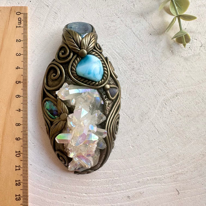 Handmade Angel Aura Quartz Cluster pendant necklace featuring Aqua Aura Quartz, Larimar, Abalone Seashell and Raw Tanzanite, a one of a kind healing crystal talisman designed for spiritual awakening.