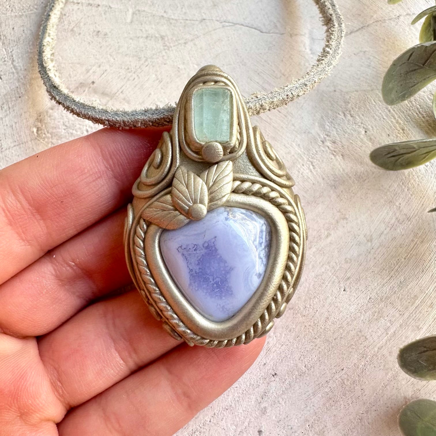 Unique gemstone pendant featuring Blue Chalcedony with Aquamarine gemstone accents.