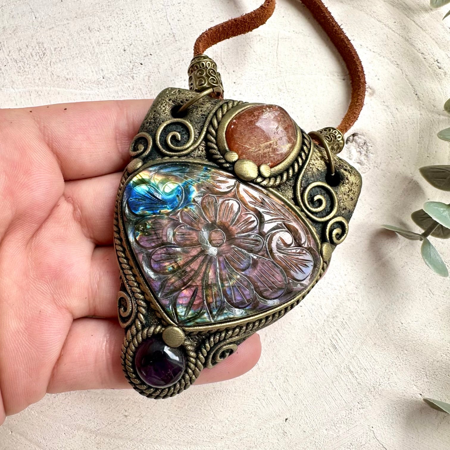 Handmade curved gemstone pendant necklace with natural crystals