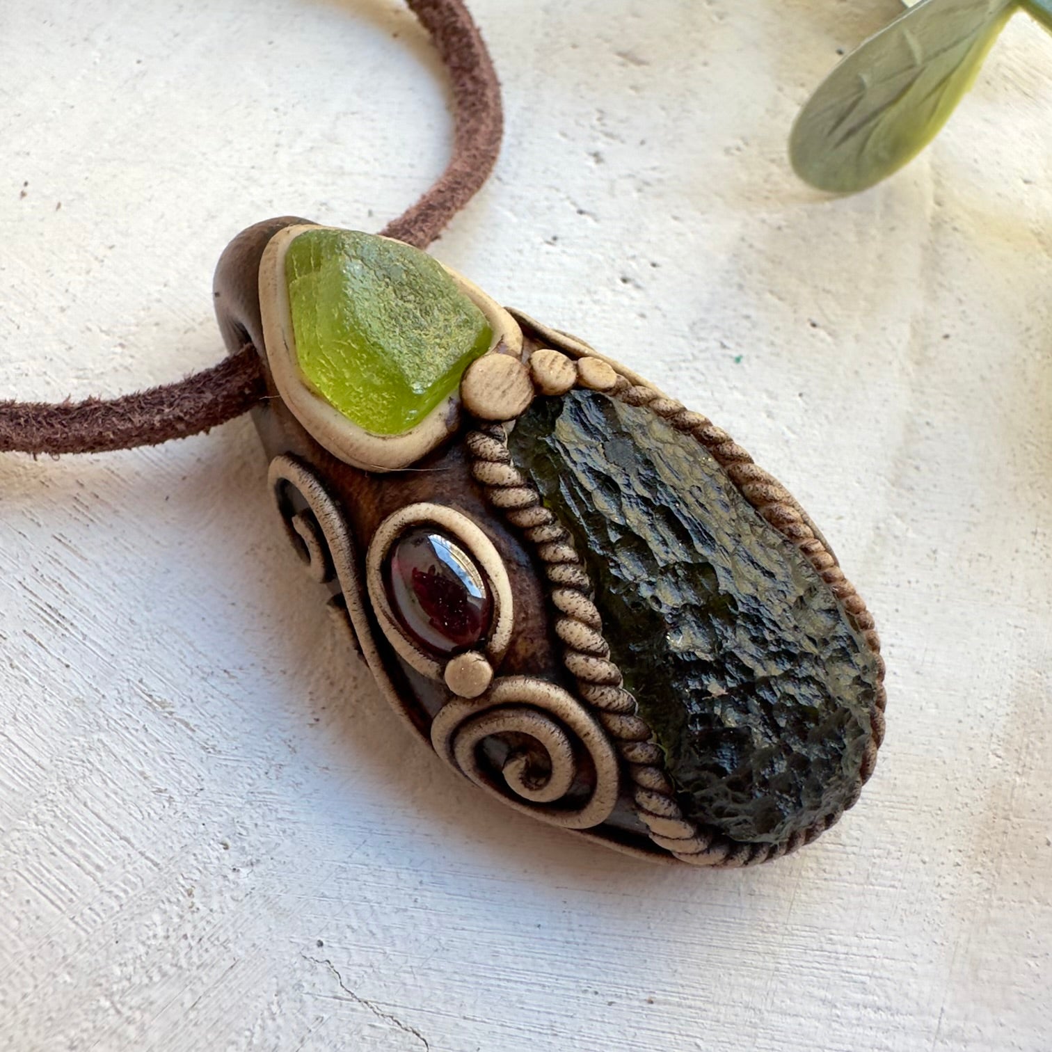 High vibration crystal jewelry with moldavite peridot and garnet