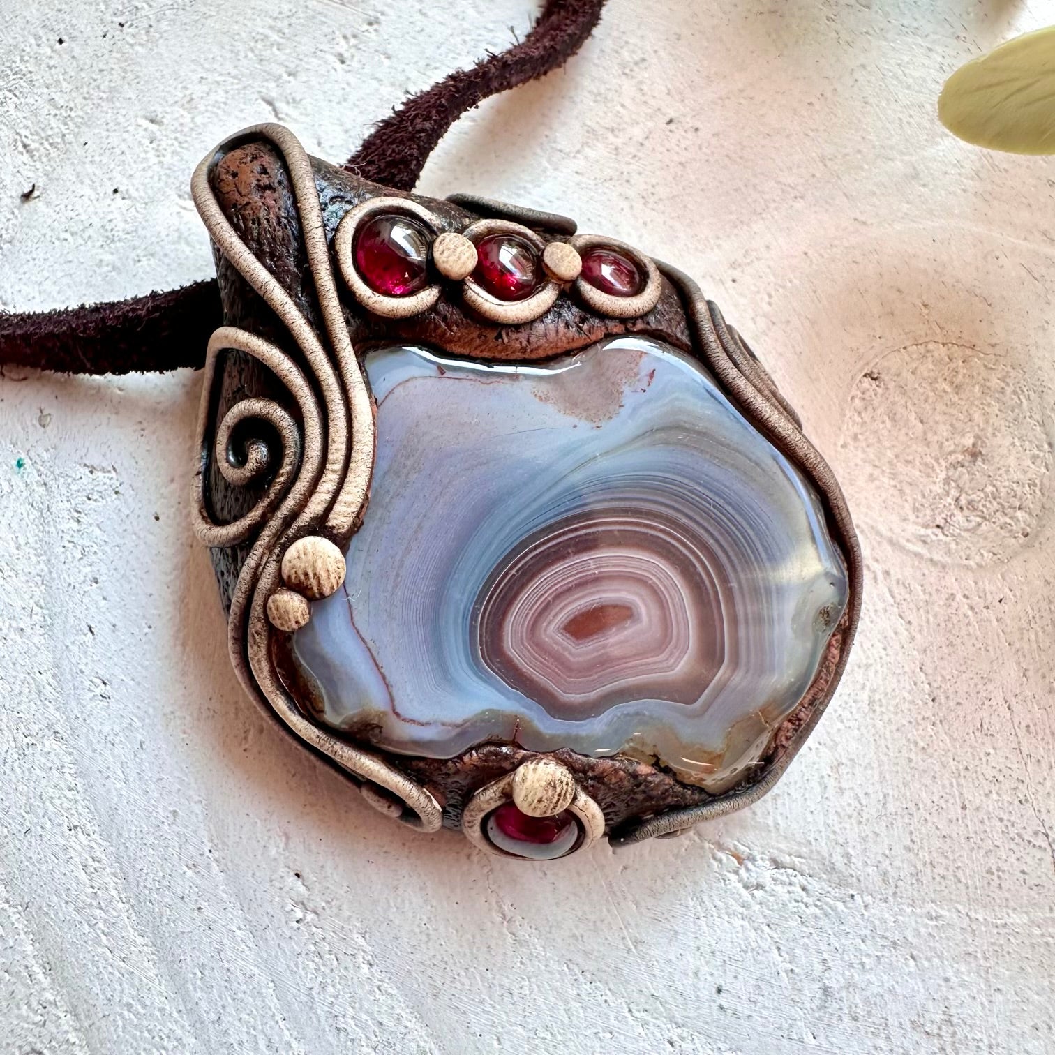 Unique handmade gemstone necklace with Botswana Agate and Rhodolite Garnet crystal pendant.