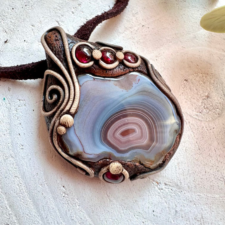Unique handmade gemstone necklace with Botswana Agate and Rhodolite Garnet crystal pendant.