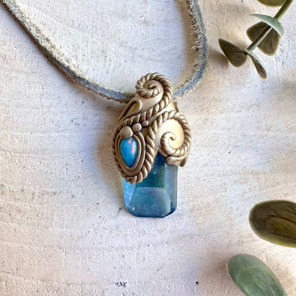 Handmade crystal jewelry combining Aqua Aura Quartz with natural Blue Ethiopian Opal.