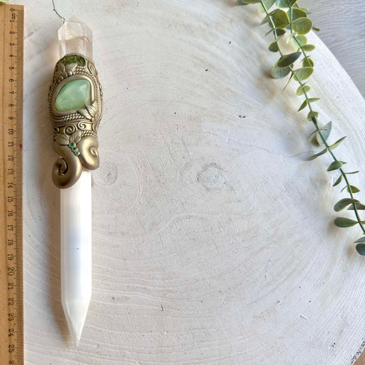 Handmade Selenite crystal tool adorned with natural Moldavite and vibrant Emerald.