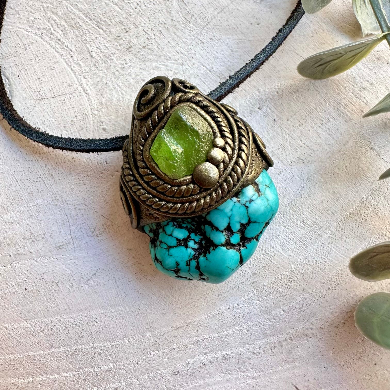 Handmade gemstone pendant combining Turquoise with natural Peridot accents.