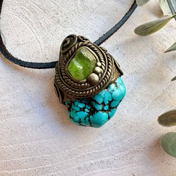 Handmade gemstone pendant combining Turquoise with natural Peridot accents.