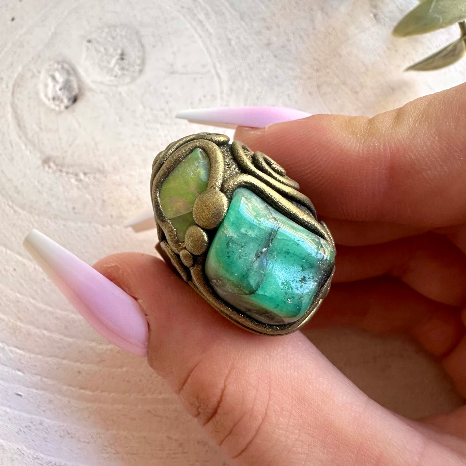 Handmade ring featuring Emerald and Raw Ethiopian Opal natural gemstones.