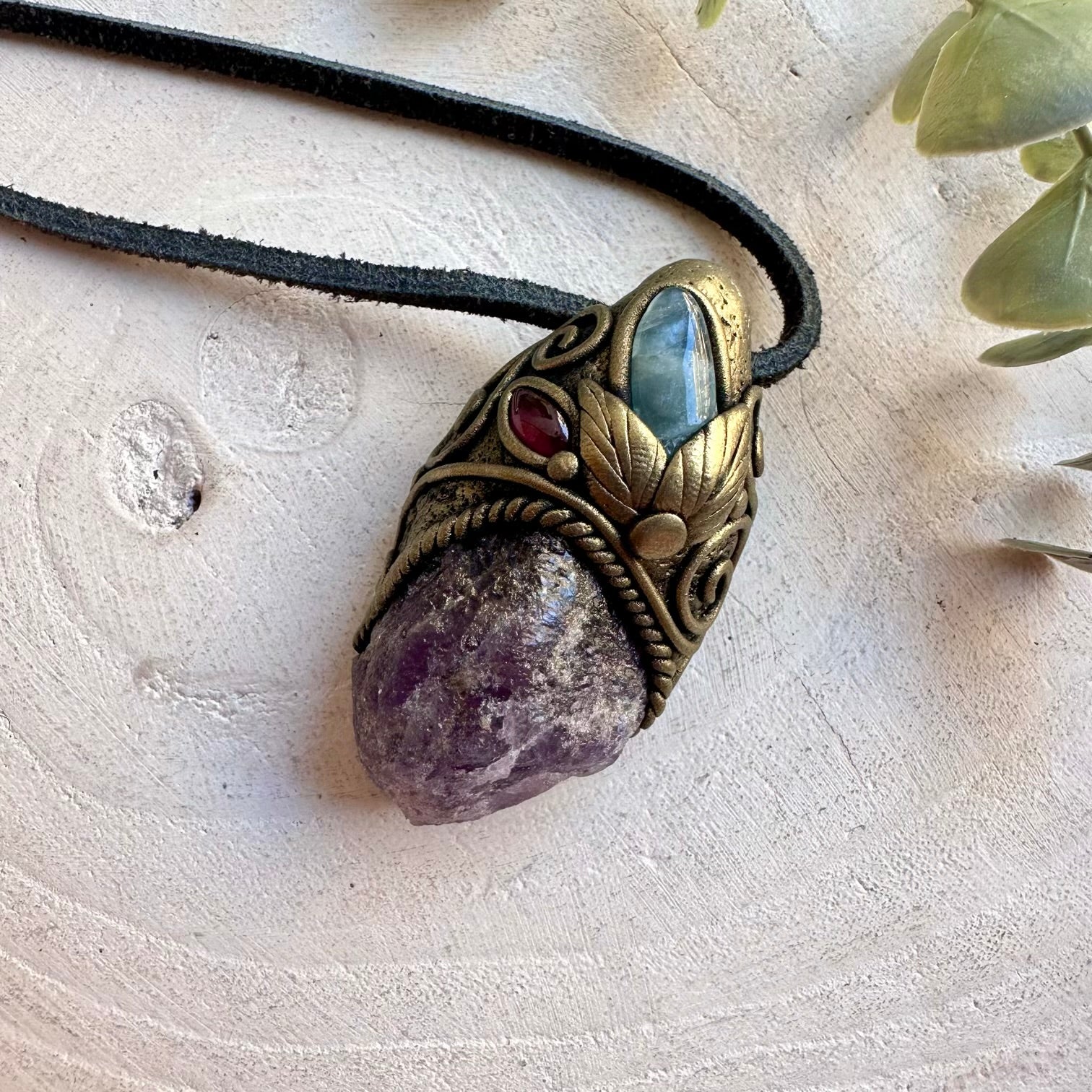 Unique healing crystal necklace featuring natural Scapolite, Aquamarine and Rhodolite Garnet.