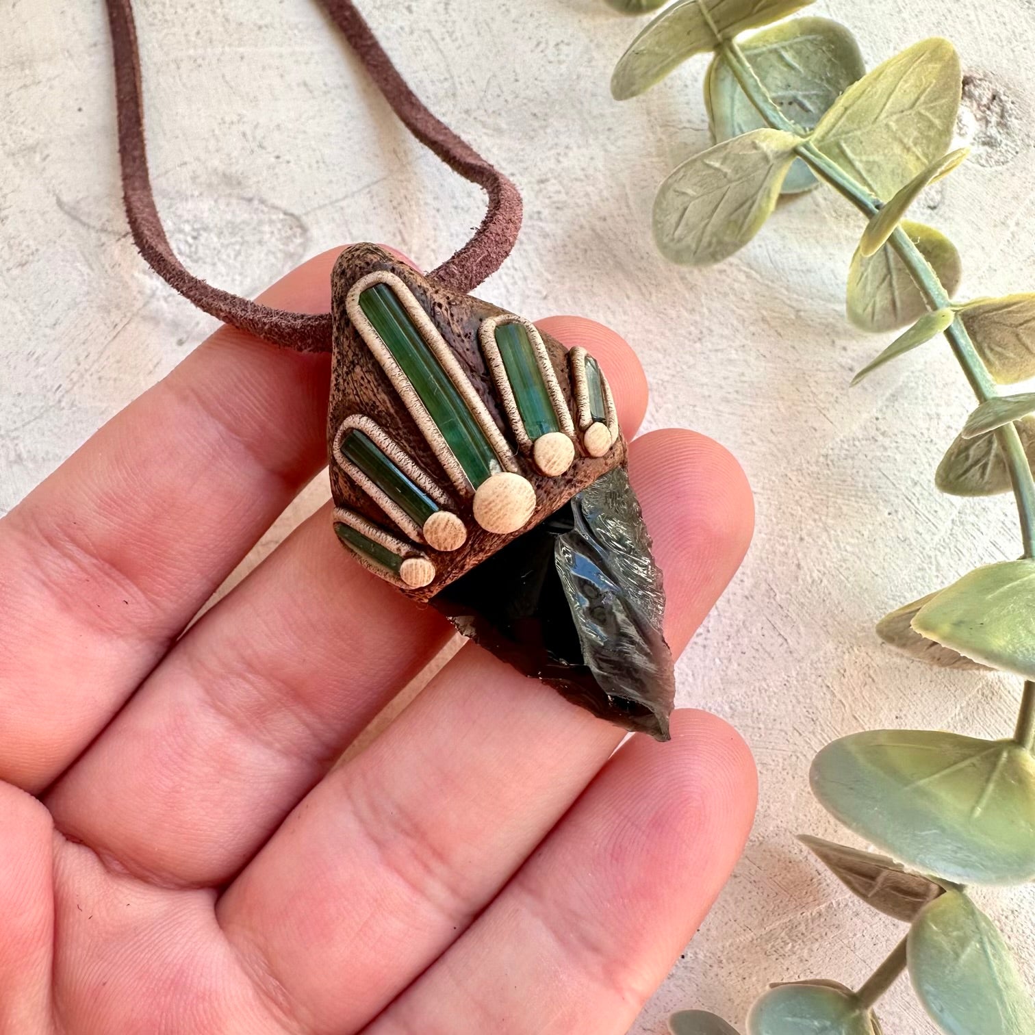 Crystal healing necklace featuring Black Obsidian Arrowhead and Green Tourmaline Crystals