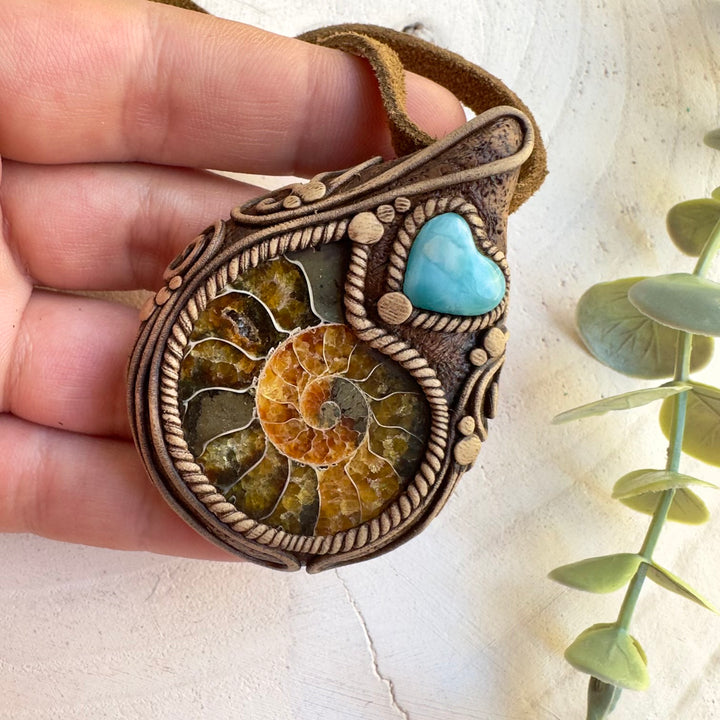 Fossil necklace combining ammonite and Larimar gemstone