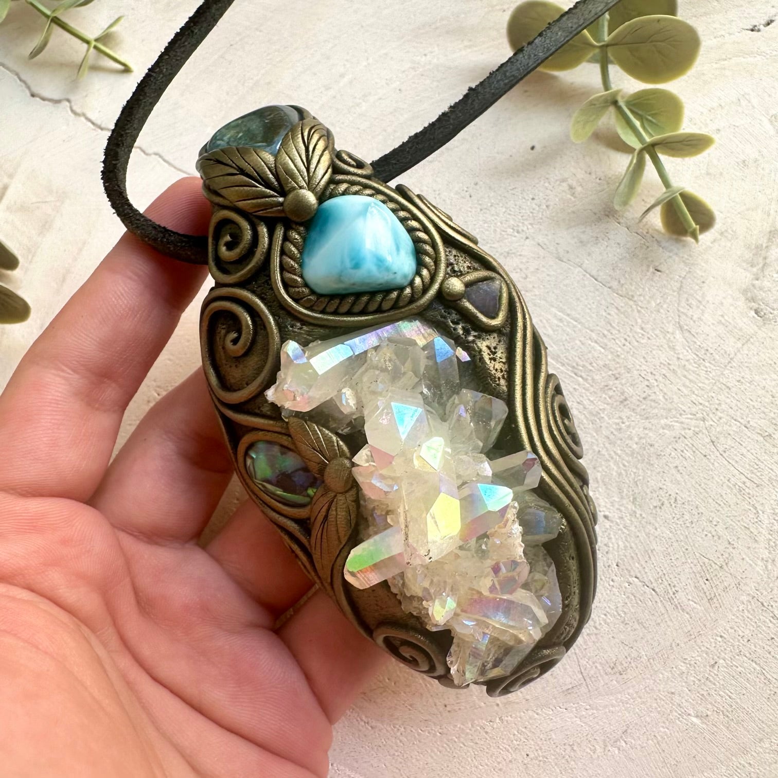 Handmade Angel Aura Quartz Cluster pendant necklace featuring Aqua Aura Quartz, Larimar, Abalone Seashell and Raw Tanzanite, a one of a kind healing crystal talisman designed for spiritual awakening, emotional balance, intuition and peaceful energy.