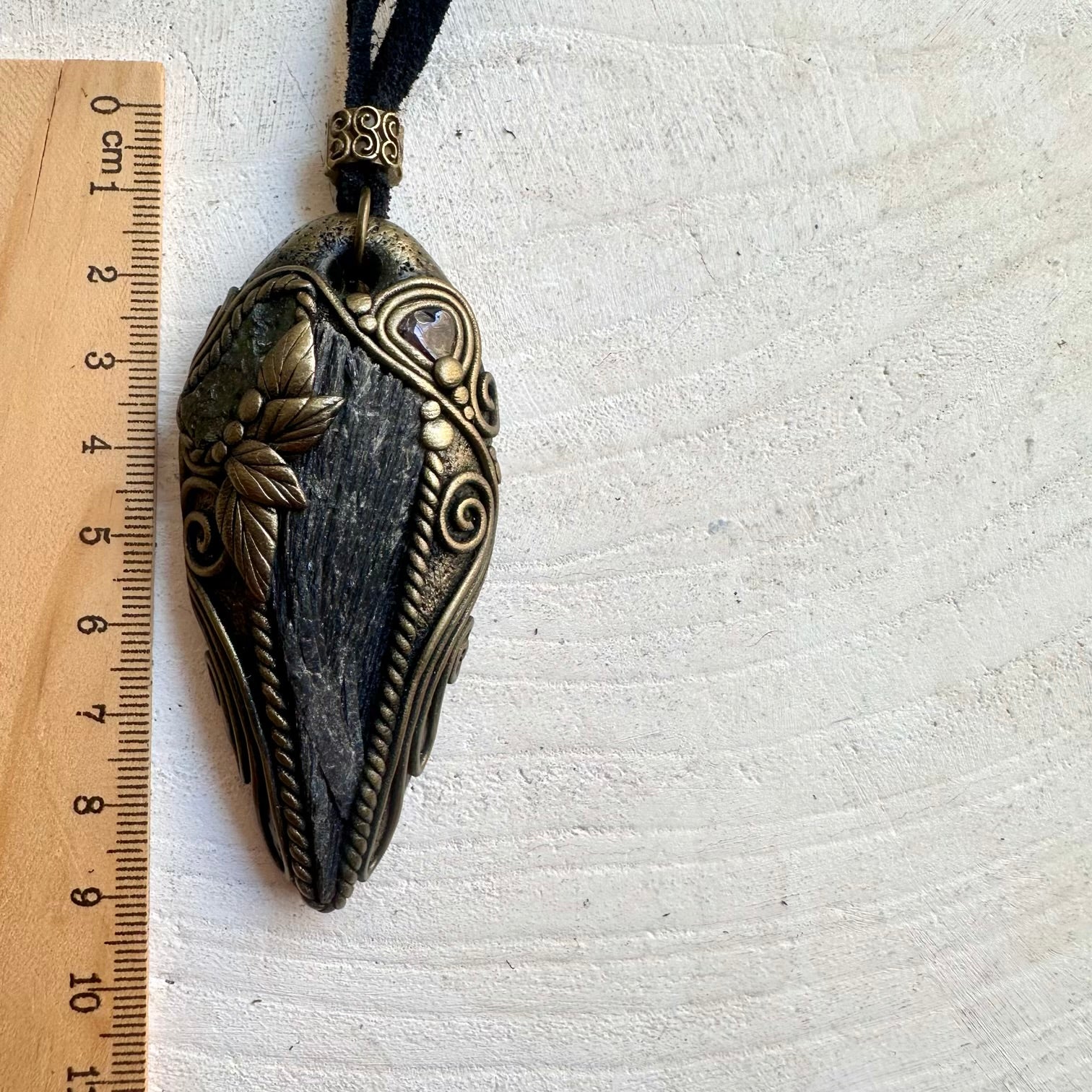 Handmade Black Kyanite pendant necklace featuring Moldavite and Red Garnet, a one of a kind crystal talisman designed for protection, grounding, transformation and personal empowerment.