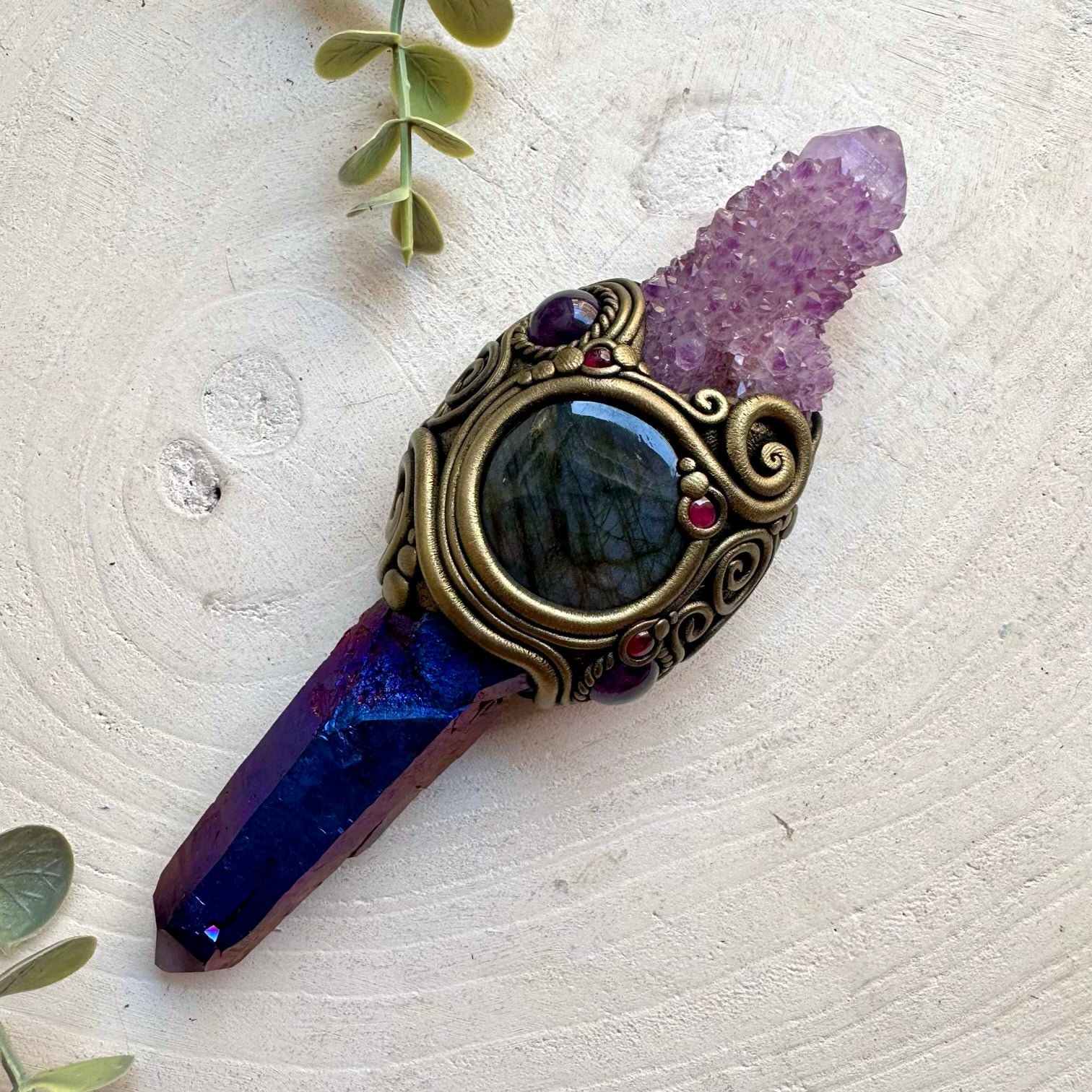 Handmade raw crystal wand featuring Cobalt Aura Quartz, Deep Purple Spirit Quartz, Labradorite, Amethyst and Rhodolite Garnet, a one of a kind energy healing and ritual tool designed for spiritual awakening, intuition, communication, protection and personal transformation.