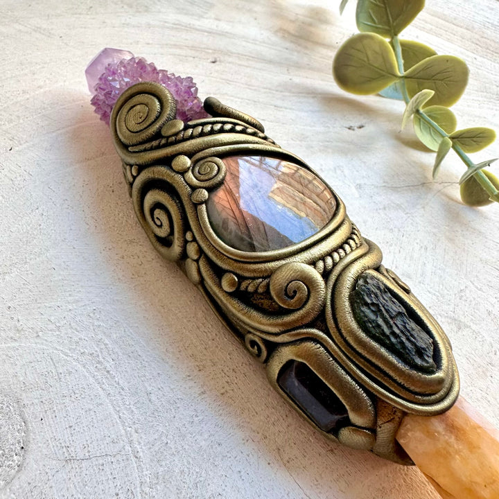 Handmade healing crystal wand featuring Golden Healer Quartz, Purple Spirit Quartz, Labradorite, Amethyst and Moldavite, a one of a kind energy and ritual tool designed for healing, manifestation, intuition, spiritual awakening and personal transformation.