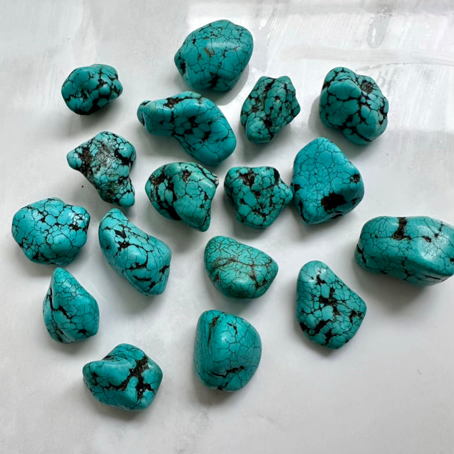 Natural turquoise gemstone nugget with blue-green color