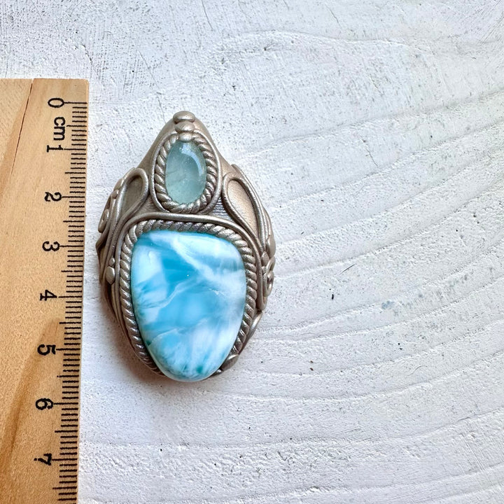 Protection amulet crystal necklace with larimar and blue topaz gemstones