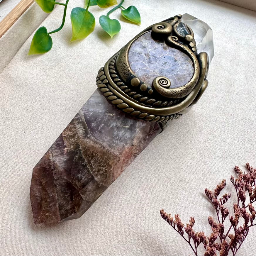 Super Seven Quartz wand with Ammonite fossil and Moldavite