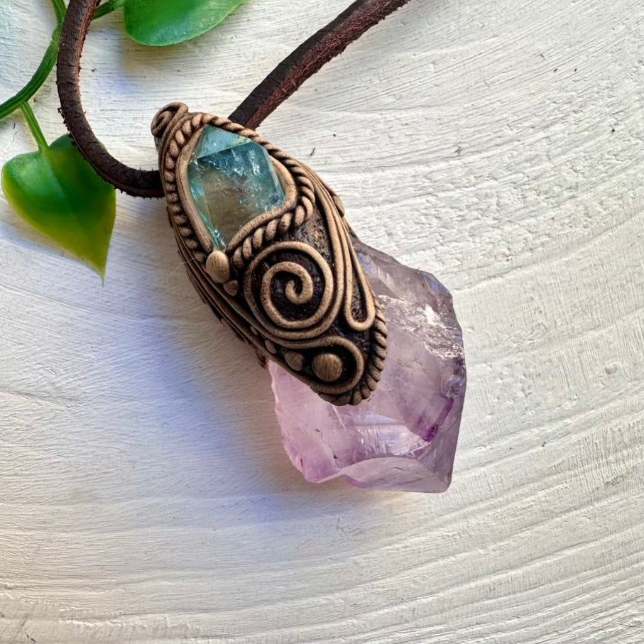 Raw Amethyst crystal paired with Aqua Aura Quartz pendant