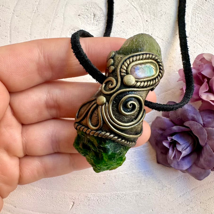 Healing crystal amulet necklace featuring raw green Moldavite, Chrome Diopside and pink-green bi-color Tourmaline pendant, handmade spiritual talisman jewelry.