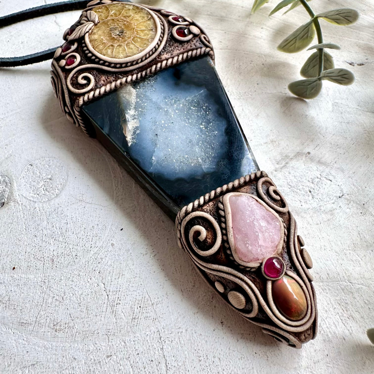 One of a kind spiritual pendant showcasing earthy Agate and Ammonite alongside soft pink Morganite, Ethiopian Opal and Rhodolite Garnet.