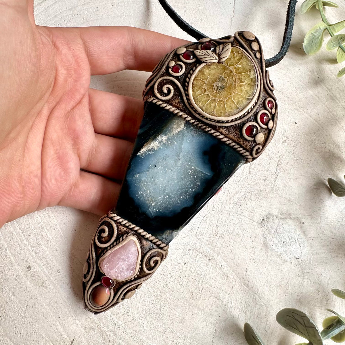 Natural Agate combined with an ancient Ammonite, raw Morganite, colorful Ethiopian Opal and Rhodolite Garnet in a unique crystal wand necklace.
