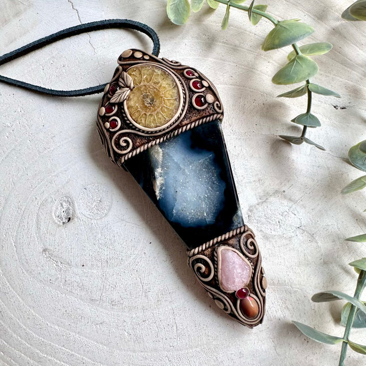 Soft pink Morganite and colorful Ethiopian Opal add delicate accents to this handmade Agate and Ammonite crystal wand, inspired by traditional metaphysical symbolism.