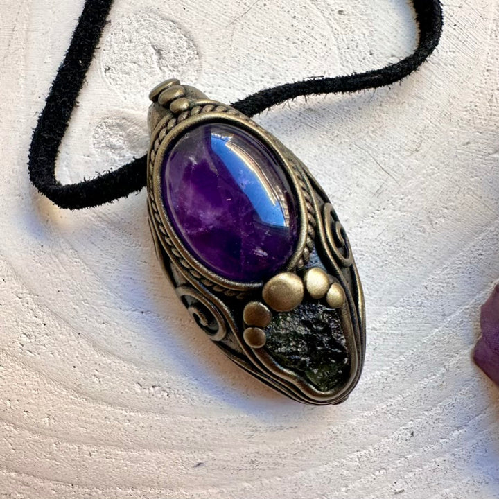 Spiritual amulet necklace featuring imperfect raw Moldavite transformation crystal and deep intuition Amethyst stone, handmade with intention.