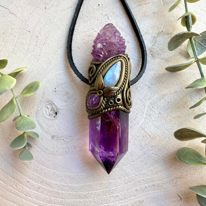Handmade Amethyst crystal wand and pendant necklace featuring Spirit Quartz, Rainbow Moonstone and Charoite. A one of a kind spiritual energy tool combining purple crystals and shimmering natural gemstones, created for meditation, intention setting, energy work and personal spiritual practice.