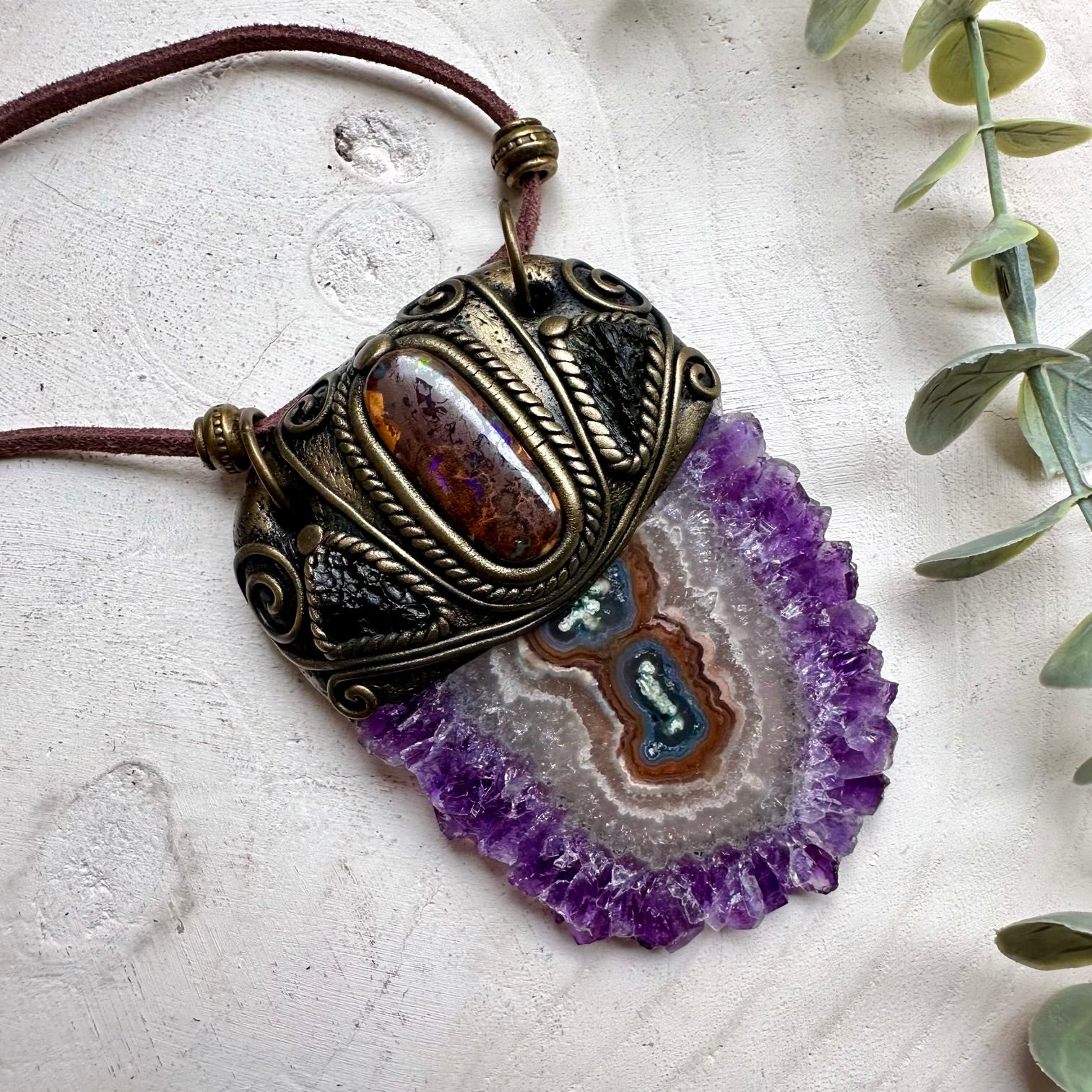 Handmade necklace featuring a large amethyst stalactite boulder opal and moldavite