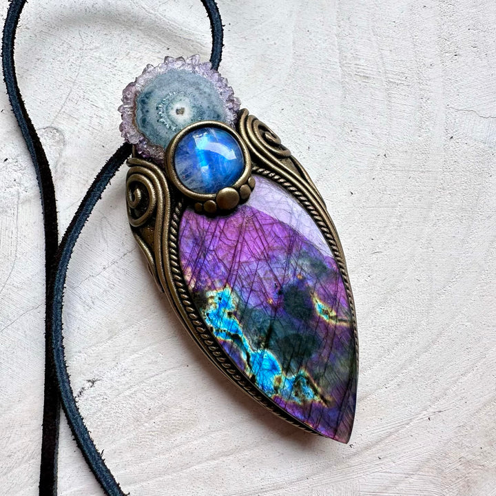 Large purple labradorite paired with amethyst stalactite and moonstone