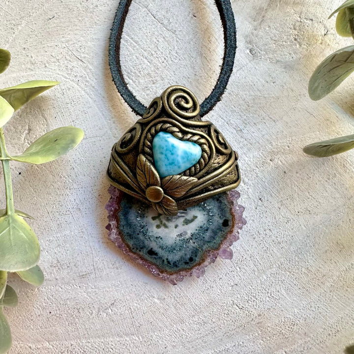 Handmade necklace featuring an Amethyst Stalactite and Larimar Heart.