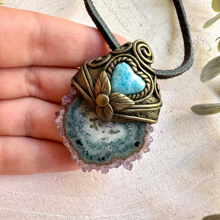 One of a kind crystal necklace with a natural Amethyst Stalactite and blue Larimar Heart.