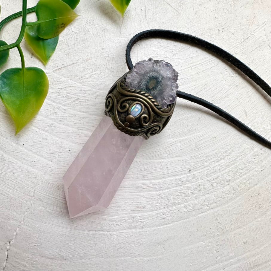 Necklace with crystal pendant on a light background