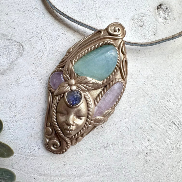 Healing crystal goddess pendant with amethyst and raw tanzanite