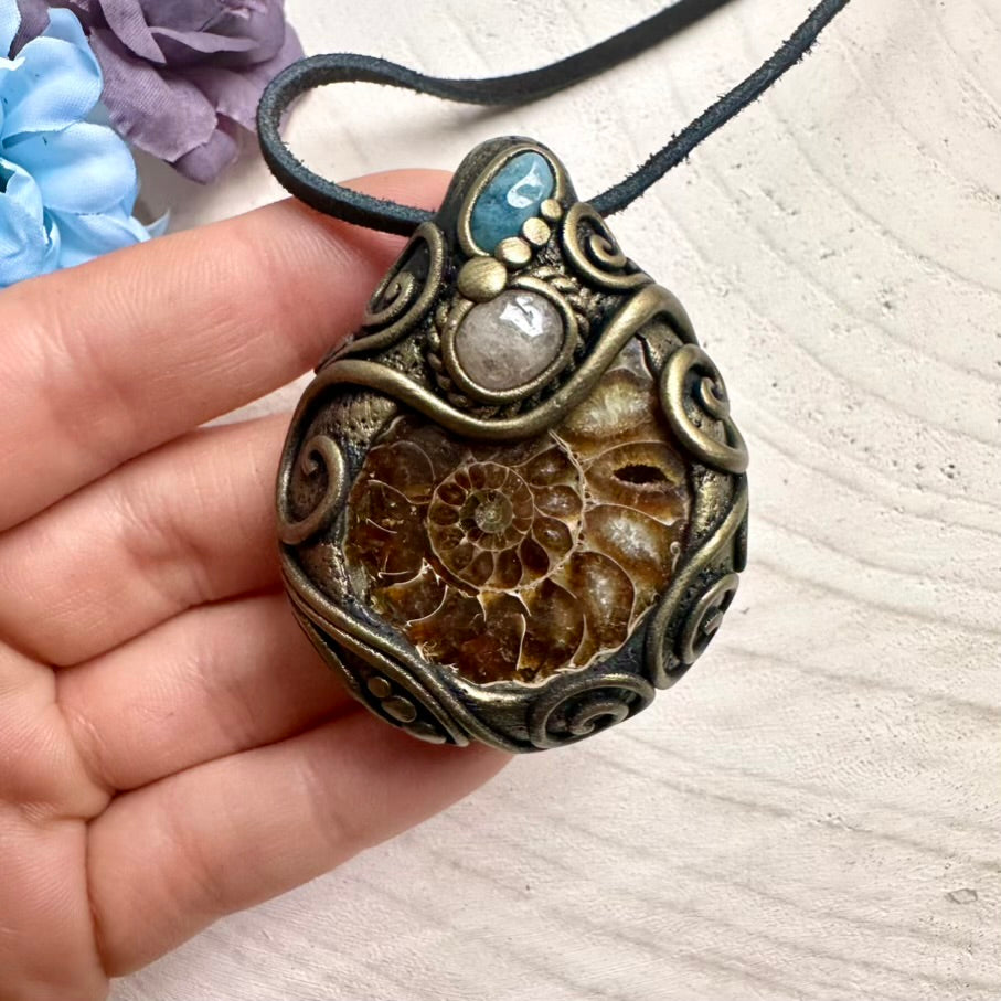 Handmade Ammonite fossil necklace with Aquamarine and soft pink Morganite, spiritual healing crystal talisman jewelry.