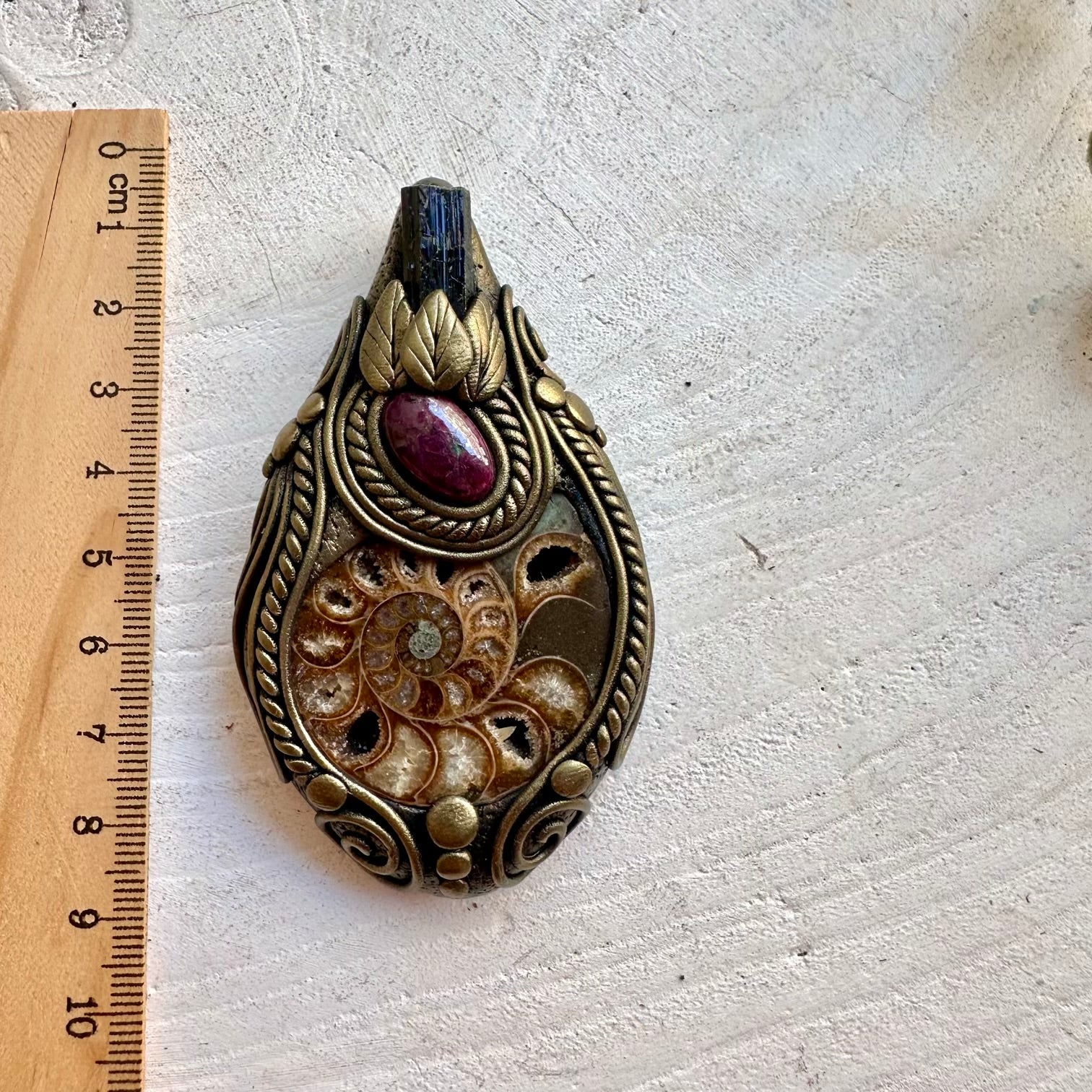 Handmade gemstone pendant necklace featuring Ammonite, Black Tourmaline and Ruby.