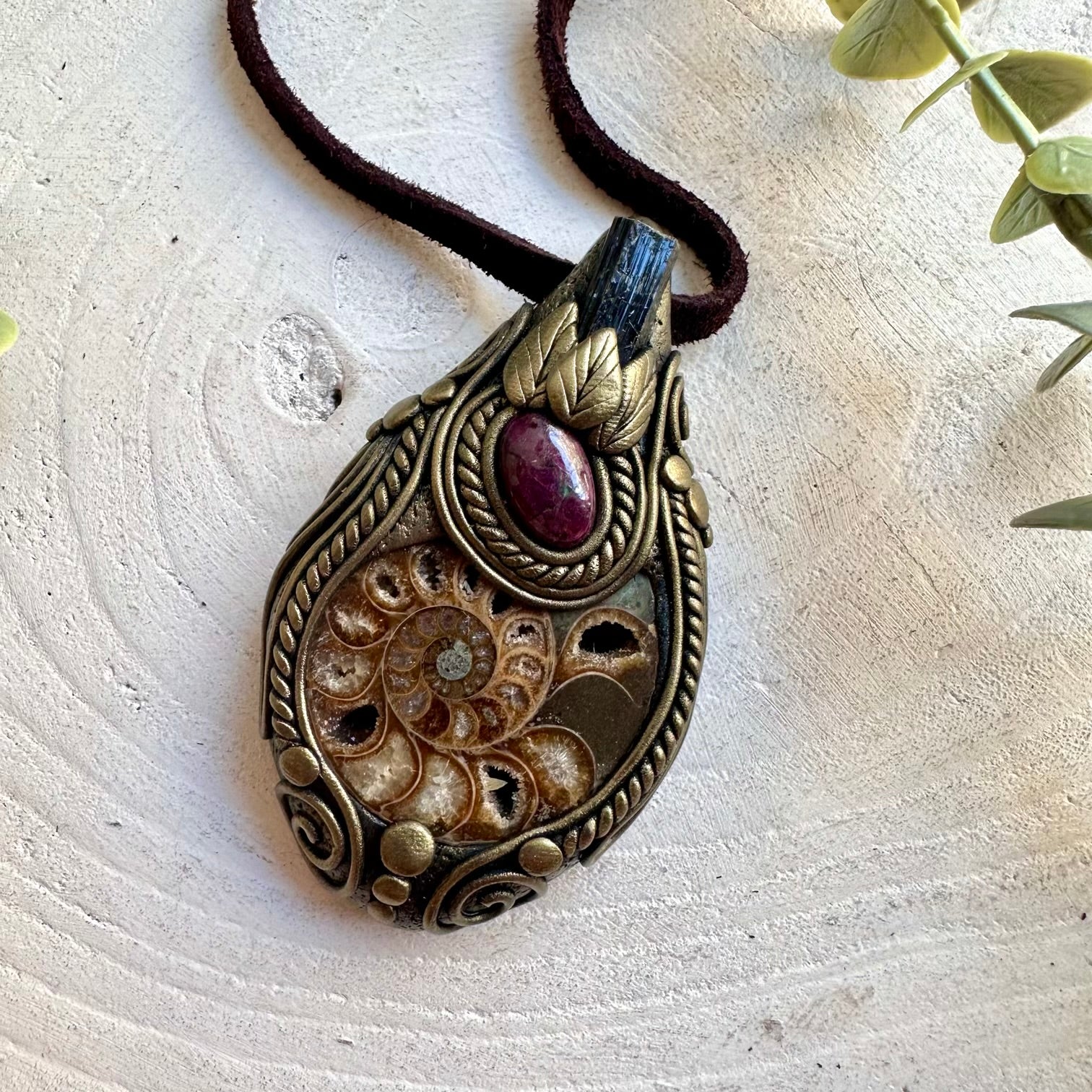 One of a kind handmade jewelry featuring the natural spiral pattern of an Ammonite fossil.