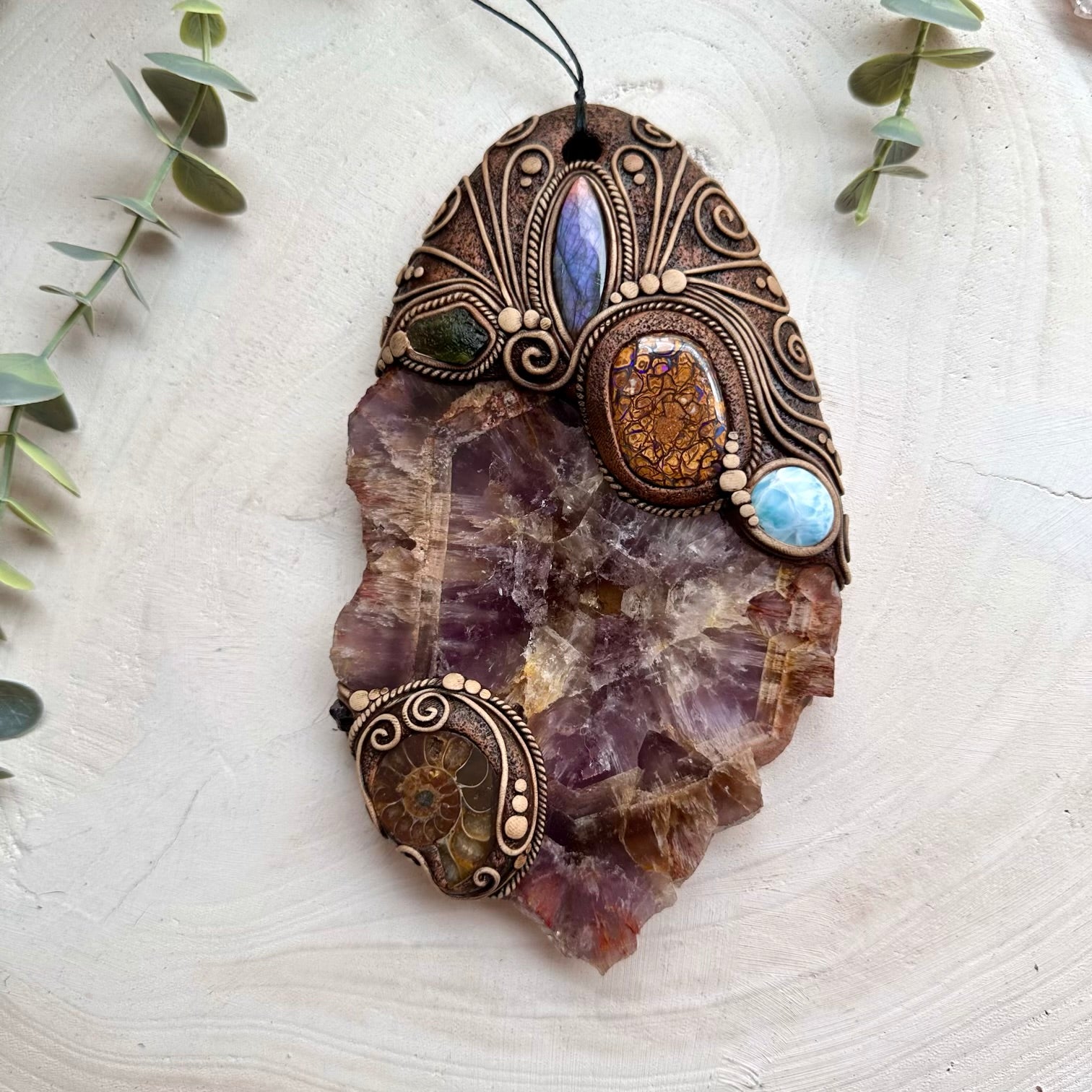 Spiritual wall art combining labradorite larimar and garnet