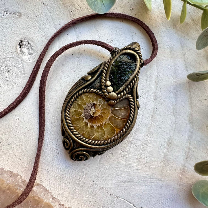Healing crystal pendant with moldavite and ammonite
