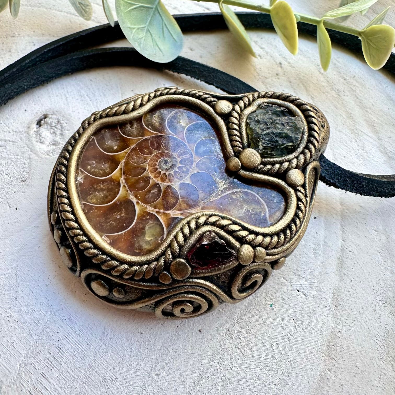 Energy pendant with moldavite ammonite and garnet