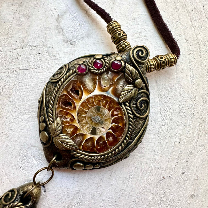 Elegant boho jewelry featuring Ammonite, Labradorite and Rhodolite Garnet in a handcrafted setting.