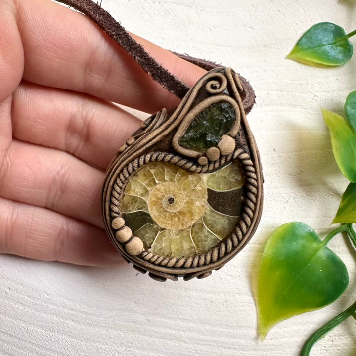 Spiritual crystal necklace featuring Ammonite and Moldavite