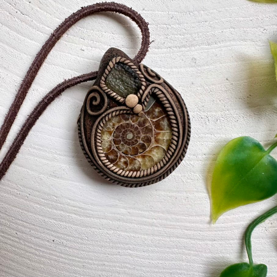 Artisan jewelry crafted with Ammonite and raw Moldavite
